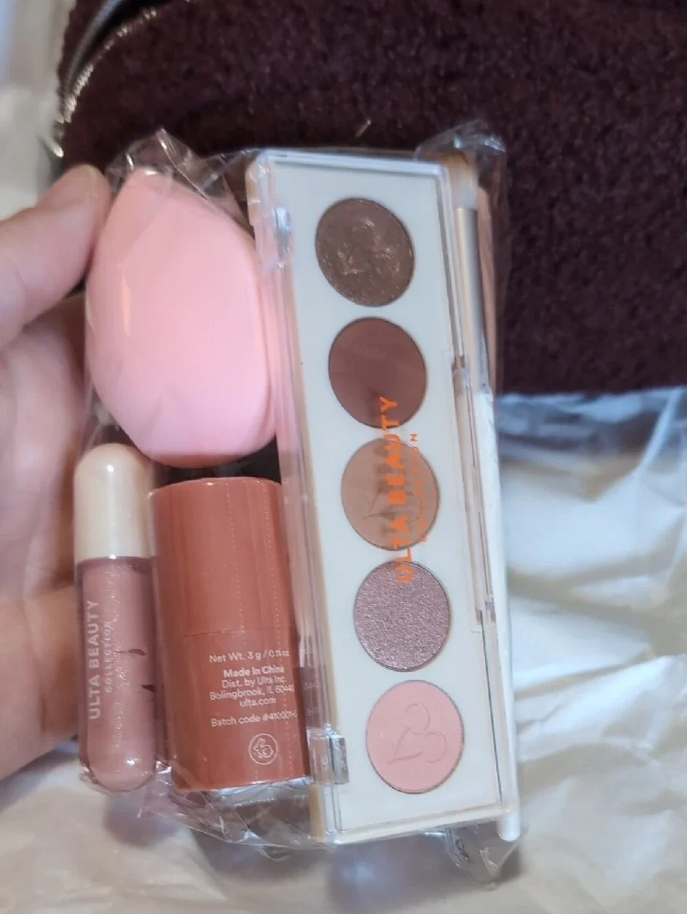Ulta Beauty Plum Cosmetic Bag with Neutral Eyeshadow Palette & Pink Sponge